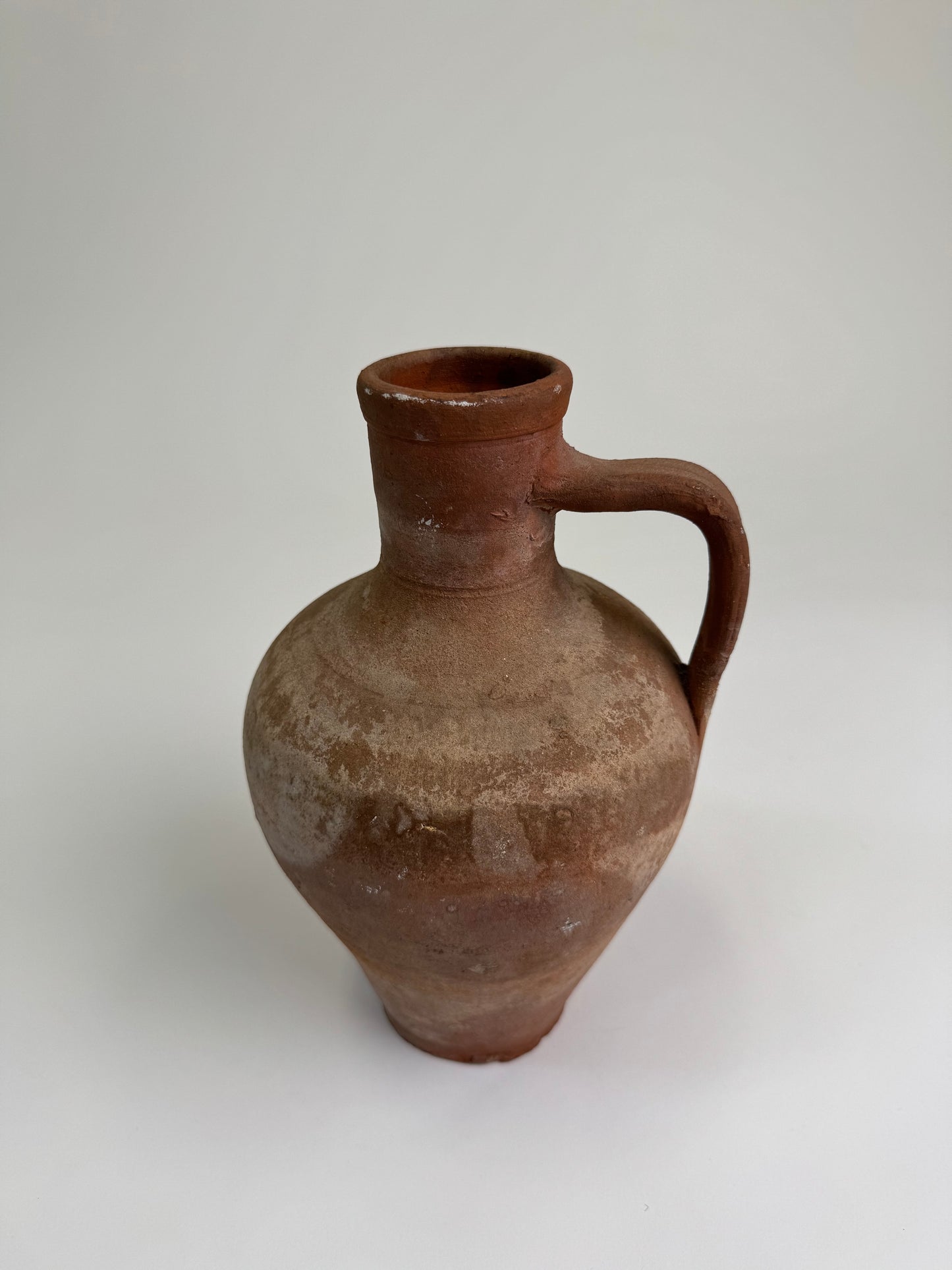 Antique terracotta jug
