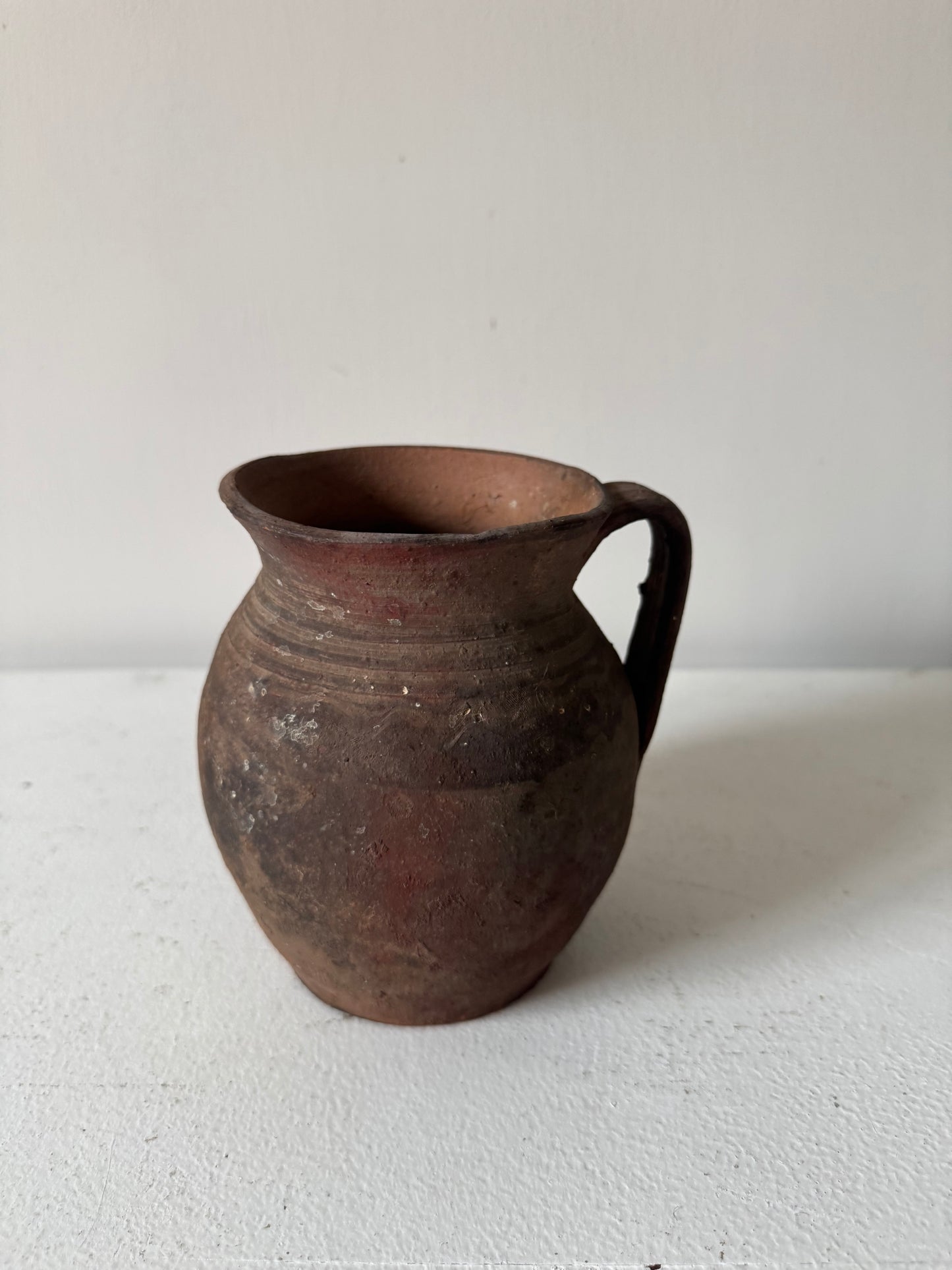 Vintage earthy pattern terracotta jug