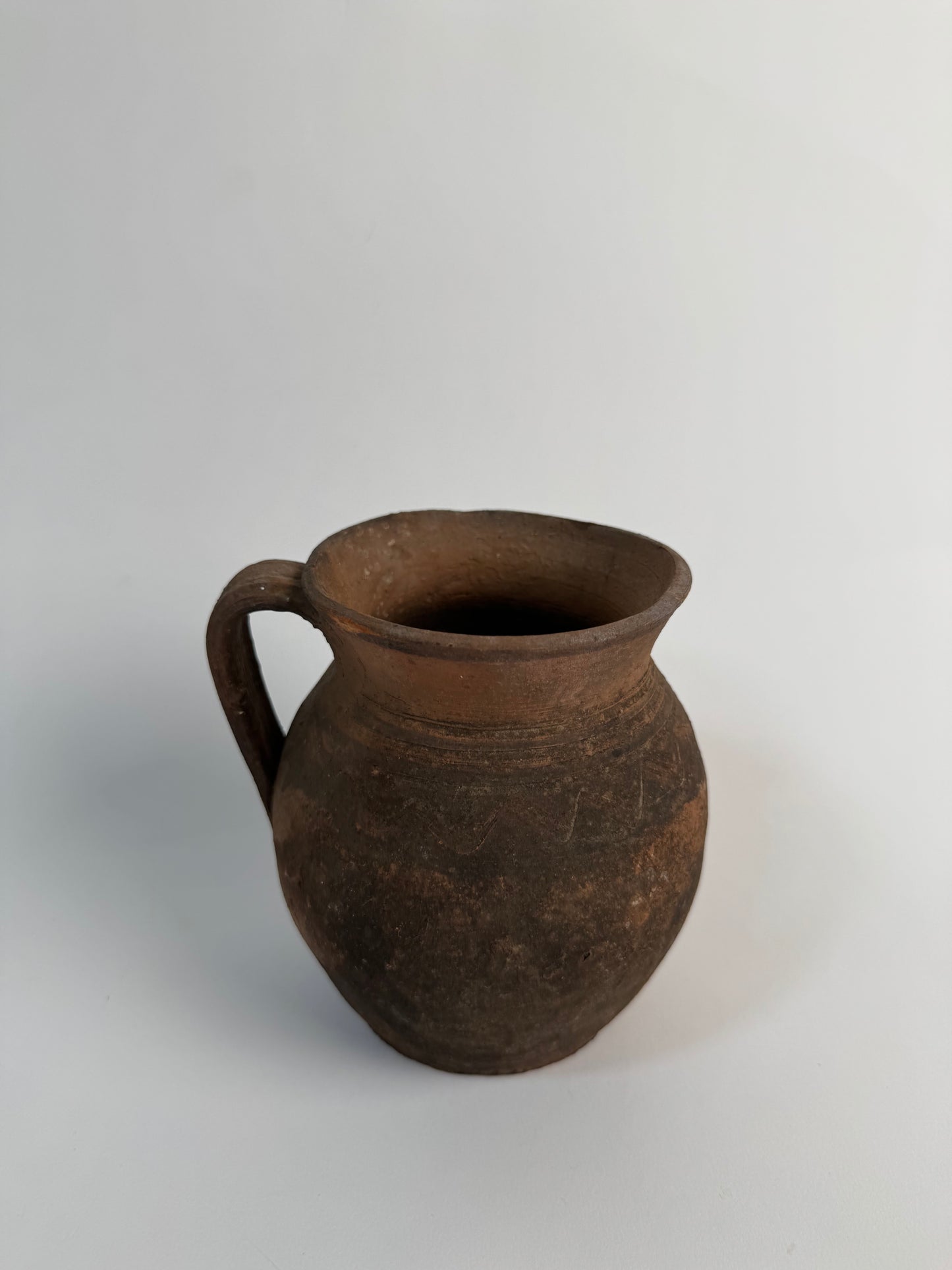 Vintage earthy pattern terracotta jug