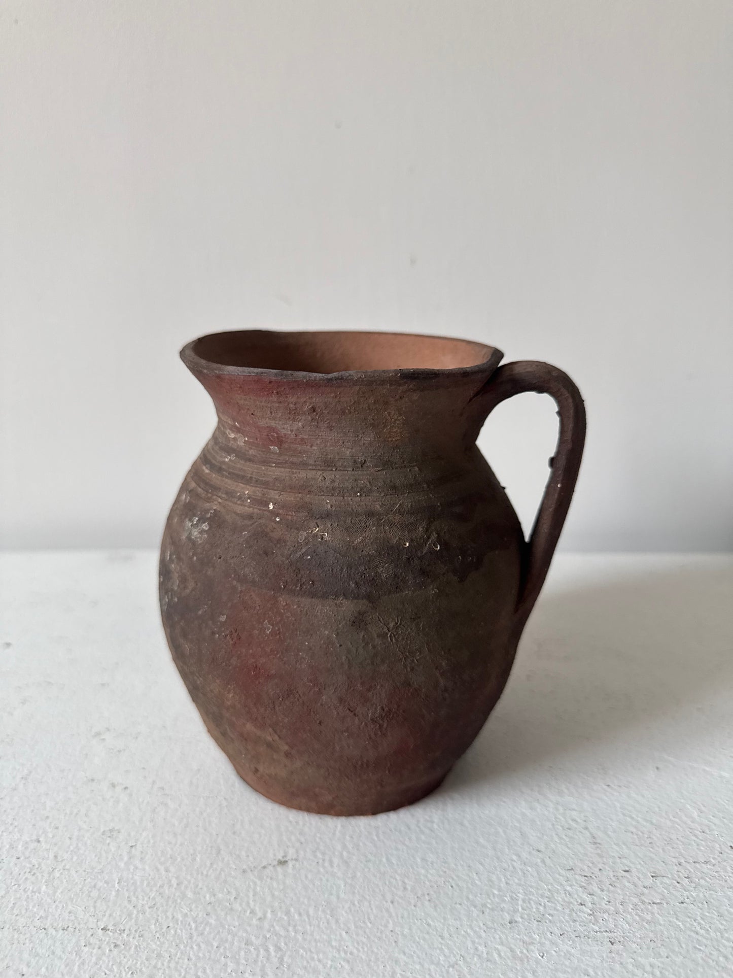 Vintage earthy pattern terracotta jug