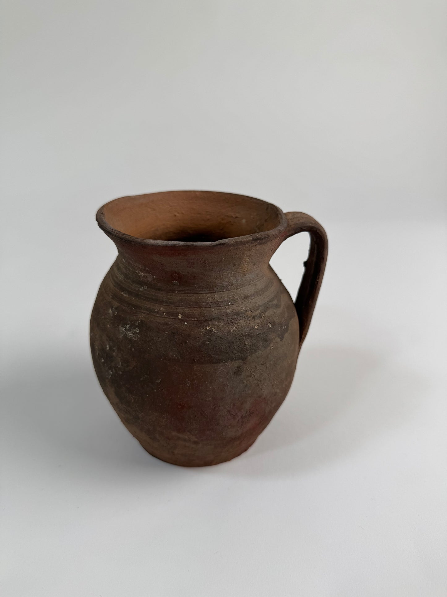 Vintage earthy pattern terracotta jug