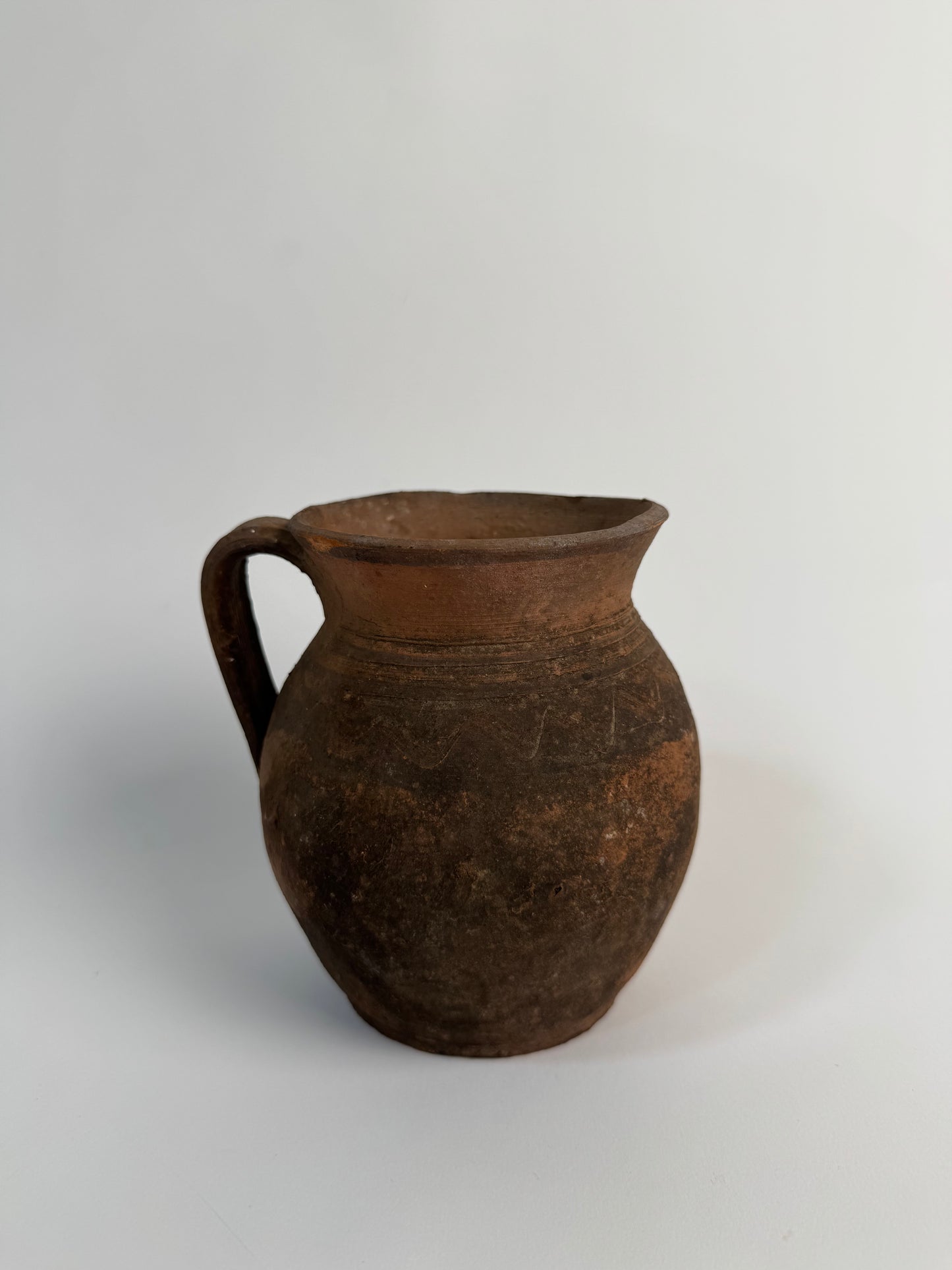 Vintage earthy pattern terracotta jug