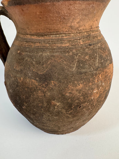 Vintage earthy pattern terracotta jug