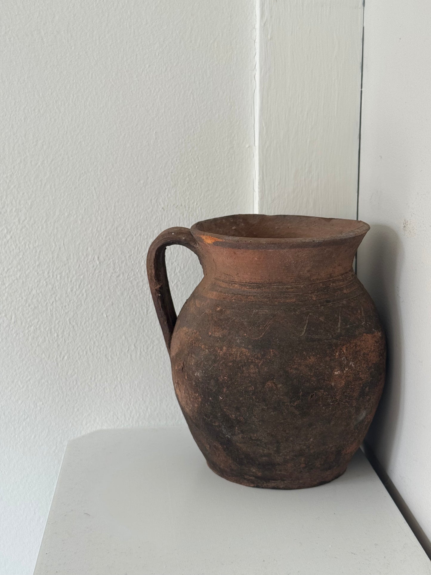 Vintage earthy pattern terracotta jug
